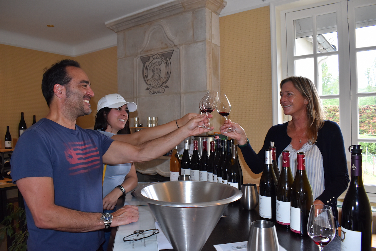 Amanda Greenbaum tasting wine in the French countryside